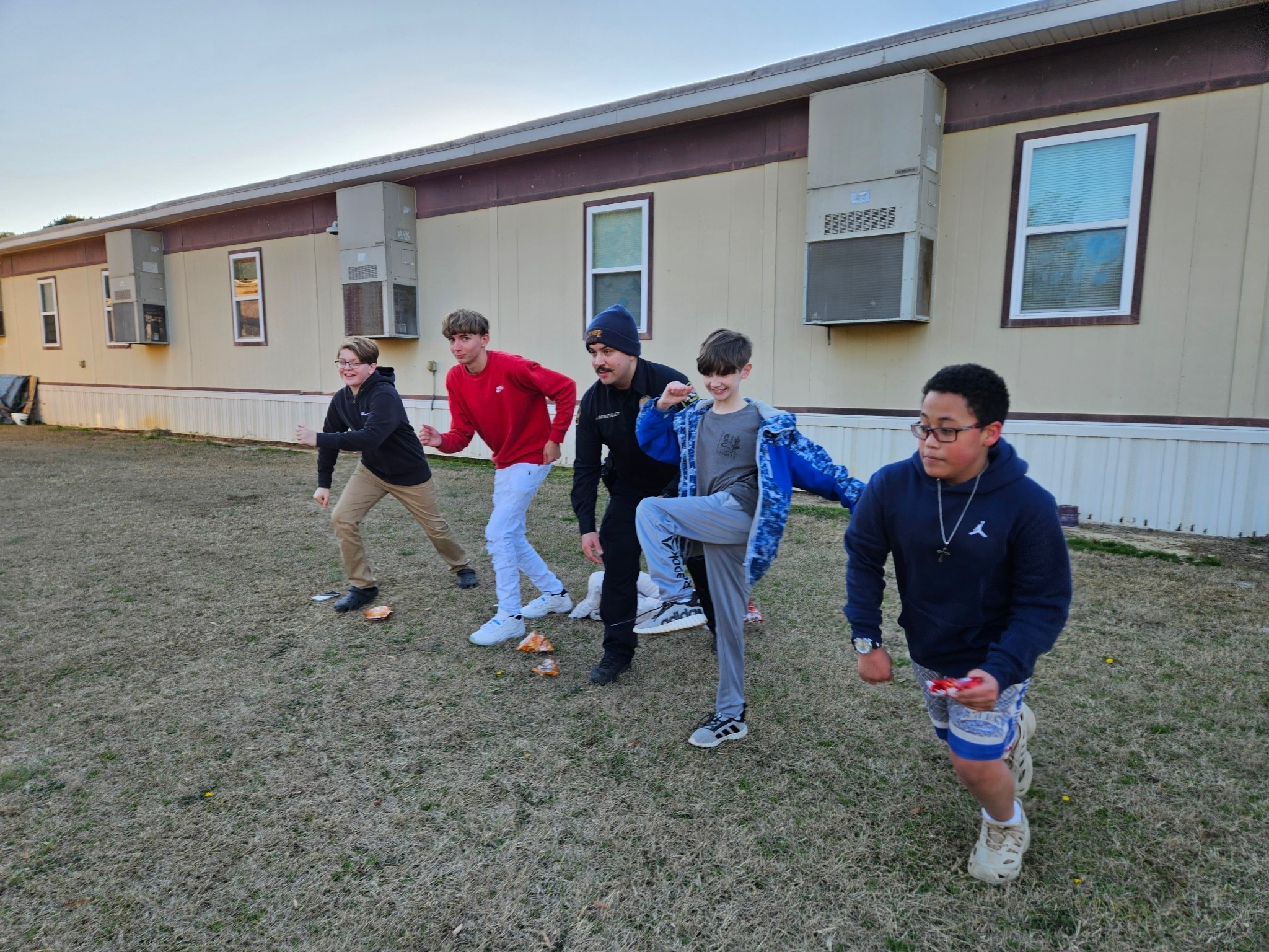 Youth and officers participating in sports and activities together