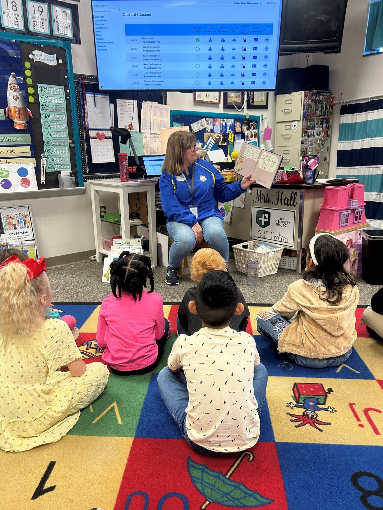 Officer reading with a child, building trust through shared activities